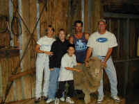 family with sheep.JPG (94035 bytes)